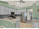 Modern kitchen with granite countertops, stainless steel appliances, and ample cabinet space, perfect for cooking at 1453 Maple Leaf Ln, Deland, FL 32724