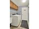 Efficient laundry room featuring modern washer and dryer, ample storage, and neutral tones at 1453 Maple Leaf Ln, Deland, FL 32724