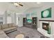 Spacious living room featuring a fireplace and built-in shelving, creating a comfortable and functional space at 1453 Maple Leaf Ln, Deland, FL 32724