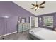 Bedroom with purple walls and walk-in closet at 1453 Maple Leaf Ln, Deland, FL 32724