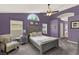 Spacious main bedroom with vaulted ceiling, fan, and comfortable furniture at 1453 Maple Leaf Ln, Deland, FL 32724