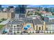 Hotel exterior with central pool courtyard and downtown cityscape backdrop at 151 E Washington St # 424, Orlando, FL 32801