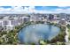 Gorgeous aerial perspective of Lake Eola, revealing the city skyline, lush green trees, and tranquil waters at 151 E Washington St # 424, Orlando, FL 32801