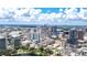 Expansive aerial view capturing a vibrant city skyline, lush greenery, and a picturesque lake for commercial opportunities at 151 E Washington St # 424, Orlando, FL 32801
