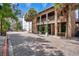 Stunning brick building featuring a two-story outdoor patio with palm trees and street access at 151 E Washington St # 424, Orlando, FL 32801
