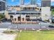An aerial view showcases the building's design, surrounding streetscape, and the adjacent green space at 151 E Washington St # 424, Orlando, FL 32801