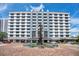 Elegant building exterior with a modern facade, surrounded by a brick plaza with outdoor seating at 151 E Washington St # 424, Orlando, FL 32801