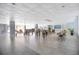 Spacious common area featuring tables, chairs, a bar, and a television at 151 E Washington St # 424, Orlando, FL 32801