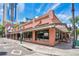 Charming corner building with a red tile roof, large windows, and an inviting storefront, perfect for dining at 151 E Washington St # 424, Orlando, FL 32801