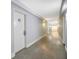 Long hallway with doors, gray walls, and light wood-look flooring at 151 E Washington St # 424, Orlando, FL 32801