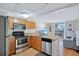 Charming kitchen with stainless steel appliances, oak cabinets and a window overlooking the neighborhood at 151 E Washington St # 424, Orlando, FL 32801