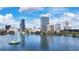 Scenic view of Lake Eola surrounded by downtown Orlando's skyline under a bright blue sky at 151 E Washington St # 424, Orlando, FL 32801