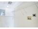 Bright laundry room offers shelving for storage and is equipped with all essential water and electrical hookups at 151 E Washington St # 424, Orlando, FL 32801