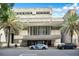 Exterior shot of the Orlando Public Library featuring modern architecture and palm trees at 151 E Washington St # 424, Orlando, FL 32801