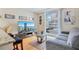 Cozy living room with a comfortable couch, TV, and a large window offering city views at 151 E Washington St # 424, Orlando, FL 32801