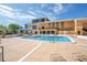 Community pool with sun loungers and shade, providing a perfect outdoor living space at 151 E Washington St # 424, Orlando, FL 32801