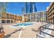 Resort-style pool with inviting blue water, surrounded by comfortable lounge chairs and lush landscaping, perfect for relaxation at 151 E Washington St # 424, Orlando, FL 32801