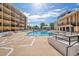 Outdoor swimming pool offering abundant seating and nearby outdoor kitchen at 151 E Washington St # 424, Orlando, FL 32801