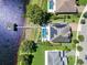 This is an aerial view of the home, pool, boat dock, and lakefront property, showcasing its prime location at 15787 Tangerine Dream Ct, Winter Garden, FL 34787