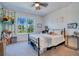 Bright bedroom with a metal bed frame and string lights at 15787 Tangerine Dream Ct, Winter Garden, FL 34787
