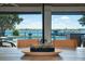 View of the pool and backyard from the dining room with a wooden table and modern chairs at 15787 Tangerine Dream Ct, Winter Garden, FL 34787