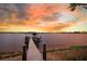 Photo of the dock, which is at the end of a long wooden walkway at 15787 Tangerine Dream Ct, Winter Garden, FL 34787