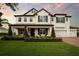 Charming two-story home with a manicured front lawn and covered entryway at 15787 Tangerine Dream Ct, Winter Garden, FL 34787