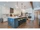 Spacious kitchen featuring a large island, stainless steel appliances, and ample cabinet space at 15787 Tangerine Dream Ct, Winter Garden, FL 34787