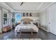 Well-lit main bedroom featuring a comfortable bed, modern decor, and a ceiling fan at 15787 Tangerine Dream Ct, Winter Garden, FL 34787