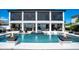 Back of house view of a beautiful pool with outdoor kitchen and seating at 15787 Tangerine Dream Ct, Winter Garden, FL 34787