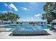 Enjoy this luxurious pool and integrated hot tub with fire bowls, stunning lake views and mature shade trees at 15787 Tangerine Dream Ct, Winter Garden, FL 34787