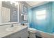 Full bathroom featuring a tub shower with blue shower curtain and white vanity with sink at 171 Cedarpark Ln, Davenport, FL 33837