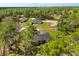 Aerial view of homes nestled amongst lush trees at 17445 Sw 41St Cir, Ocala, FL 34473