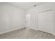Bedroom with light wood-look floors, closet, and open doorway at 17445 Sw 41St Cir, Ocala, FL 34473