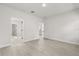 Spacious bedroom with multiple doorways and wood-look vinyl flooring at 17445 Sw 41St Cir, Ocala, FL 34473