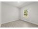 Bright bedroom with a nature view from the window at 17445 Sw 41St Cir, Ocala, FL 34473