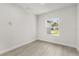 Bedroom with wood-look floors, one window, and a ceiling vent at 17445 Sw 41St Cir, Ocala, FL 34473