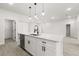 Open kitchen featuring a central island, dishwasher, stainless steel sink, and modern finishes at 17445 Sw 41St Cir, Ocala, FL 34473
