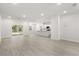 Spacious and modern open-concept living space with new flooring and recessed lighting at 17445 Sw 41St Cir, Ocala, FL 34473