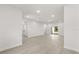 Open-concept living space featuring modern floors, and access to a bathroom at 17445 Sw 41St Cir, Ocala, FL 34473