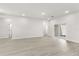 Large open living area featuring modern floors and access to an outdoor patio at 17445 Sw 41St Cir, Ocala, FL 34473