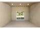Enclosed patio with sliding glass doors offering outdoor access and natural light at 17445 Sw 41St Cir, Ocala, FL 34473
