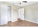 Neutral bedroom featuring closet and new laminate floors at 214 S Cottage Hill Rd, Orlando, FL 32805