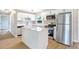 Modern kitchen featuring white cabinets, quartz countertops, and stainless steel appliances at 214 S Cottage Hill Rd, Orlando, FL 32805
