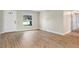 Inviting living room boasts laminate flooring and a bright window at 214 S Cottage Hill Rd, Orlando, FL 32805