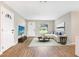 Bright living room with light walls, vinyl floors, and a large window overlooking the yard at 214 S Cottage Hill Rd, Orlando, FL 32805
