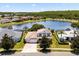 Beautiful home with a lake view, mature trees, and well-maintained lawns in a quiet neighborhood at 2512 Chapala Dr, Kissimmee, FL 34746