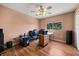 Bedroom featuring a ceiling fan with lights, wood-look floors, and large window at 2512 Chapala Dr, Kissimmee, FL 34746