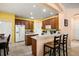 Bright kitchen features tiled floors, breakfast bar, and wooden cabinetry at 2512 Chapala Dr, Kissimmee, FL 34746