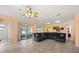 Spacious living room featuring recessed lighting, tile floors, and a large sectional couch with views to the backyard at 2512 Chapala Dr, Kissimmee, FL 34746